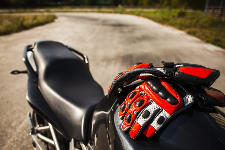 black-motorbike-with-riding-red-gloves